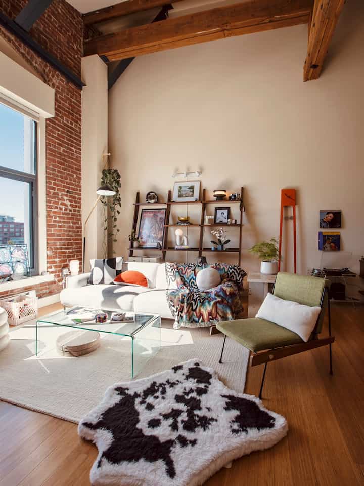 Wood tone and white living room featuring Mid-Century Modern sofa and dog bed with a warm, vintage-inspired atmosphere