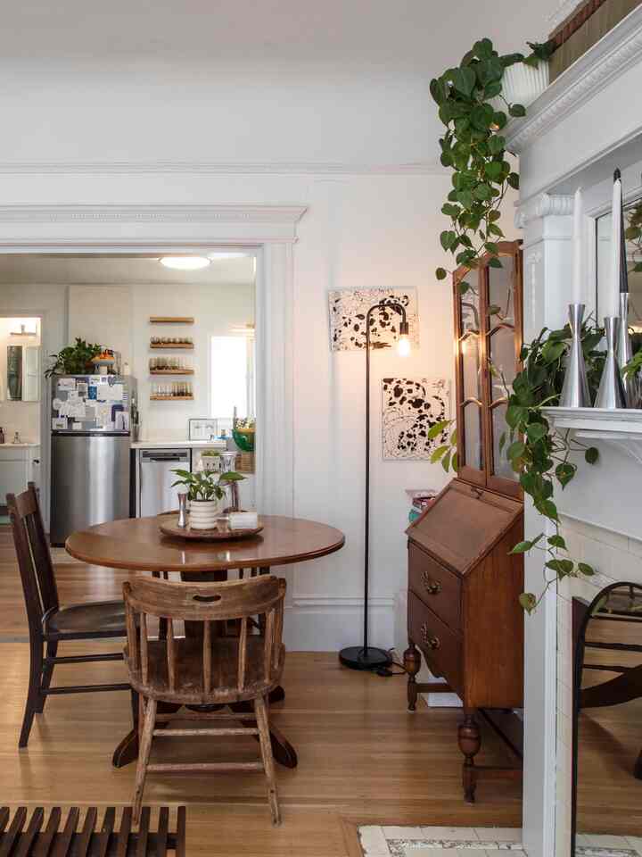 White and brown toned dining room featuring wooden dining table and chairs with warm natural atmosphere