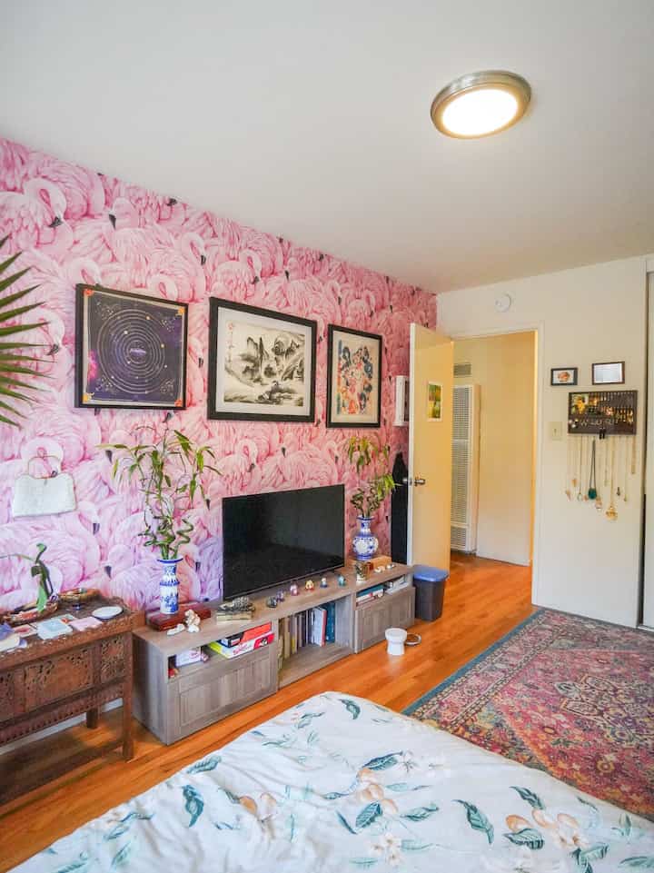 Pink flamingo wallpaper in my bedroom! I love this accent wall #vintage #curated #eclectic