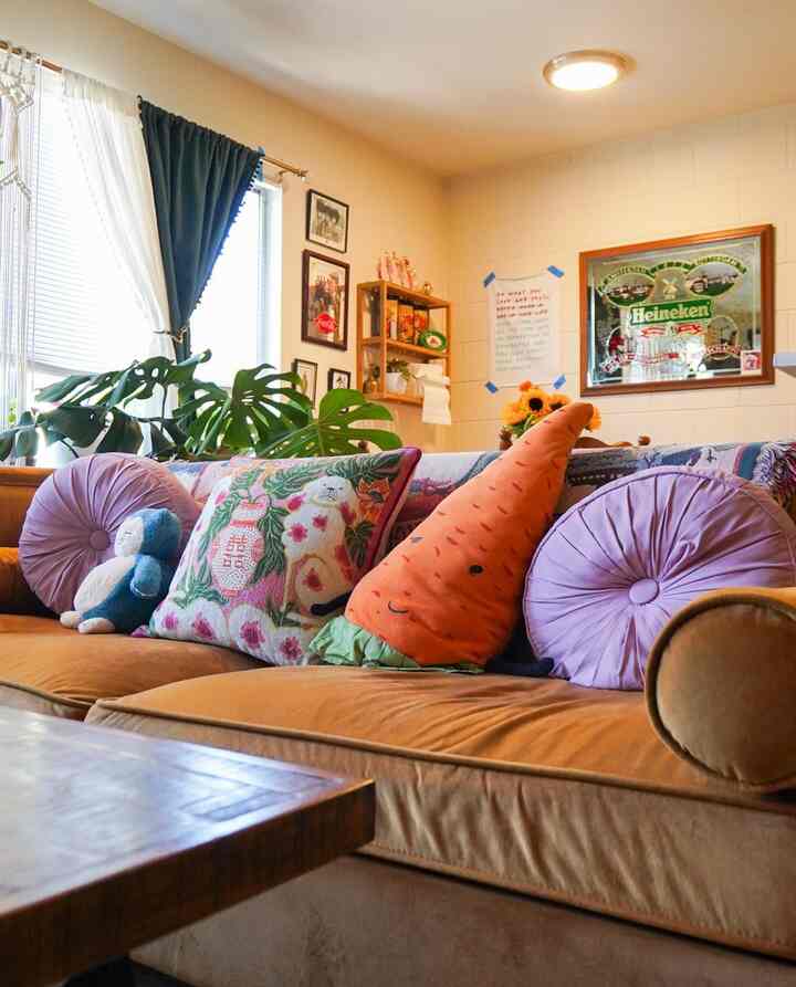 Even my pillows are curated! #orangecouch #colorful 
