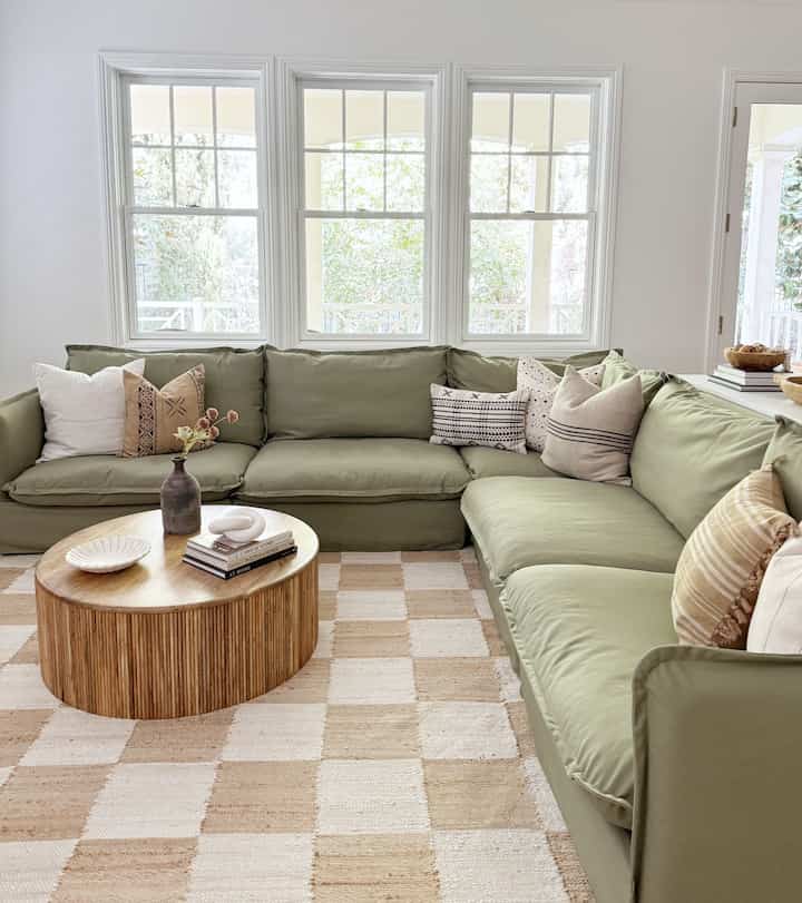 Neutral organic modern living room. #greensofa #livingroominteriors #livingroomtable #livingroominspo #coffeetable<!-- notionvc: 86c0fee0-5f95-4afa-a0b6-4c72545629b6 -->