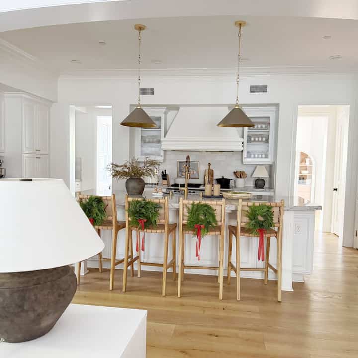 Holiday decorating in kitchen. #holidaywreath #christmasdecor #kitchendecor #christmaskitchen