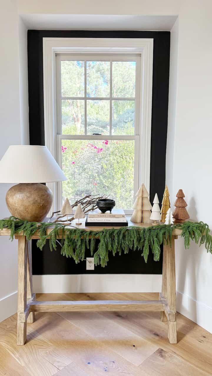 Festive entryway console table. #garland #christmasdecor #christmas #christmasgarland