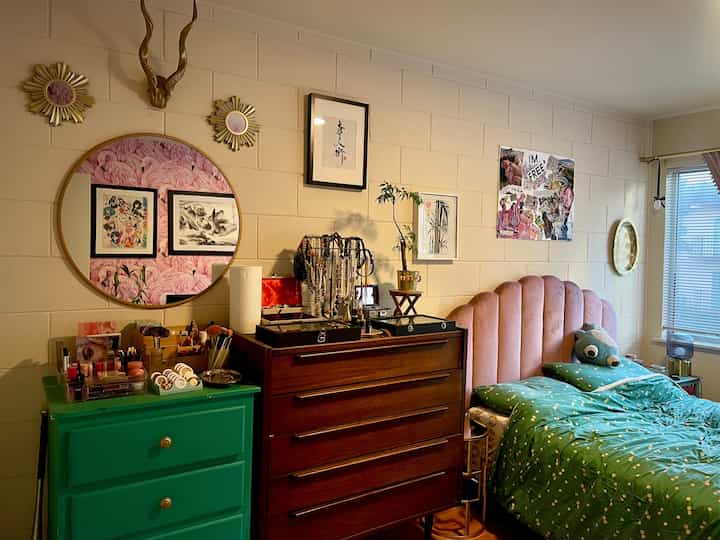 My bedroom wall looks a lot more complete with a #pinkheadboard and some artwork to complete the walls! #eclecticdecor #mcm