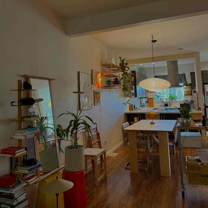 A natural modern dining room and kitchen connected space with soft beige tones and wooden furniture in a 6-tatami-sized area