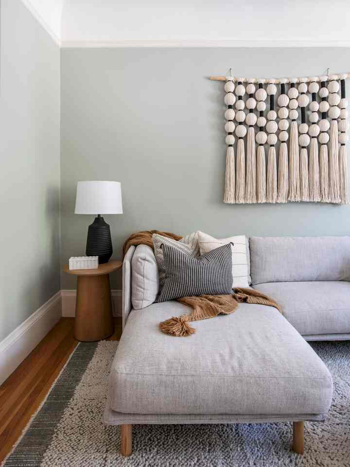 Its all about the mix of high & low in this eclectic living room! #livingroominterior #livingroom #livingroomlighting #livingroomsofa #livingroomstyling 