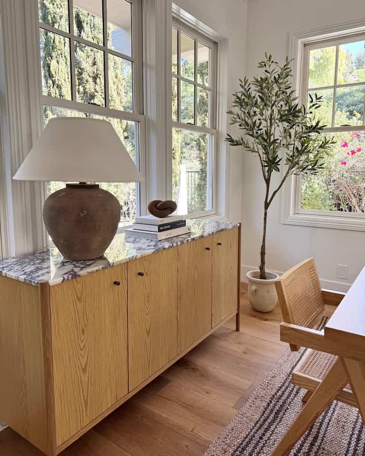 Organic modern sodeboard styling in our dining room. #modernorganic #diningroomstyling #neutralinteriors #moderninterior 