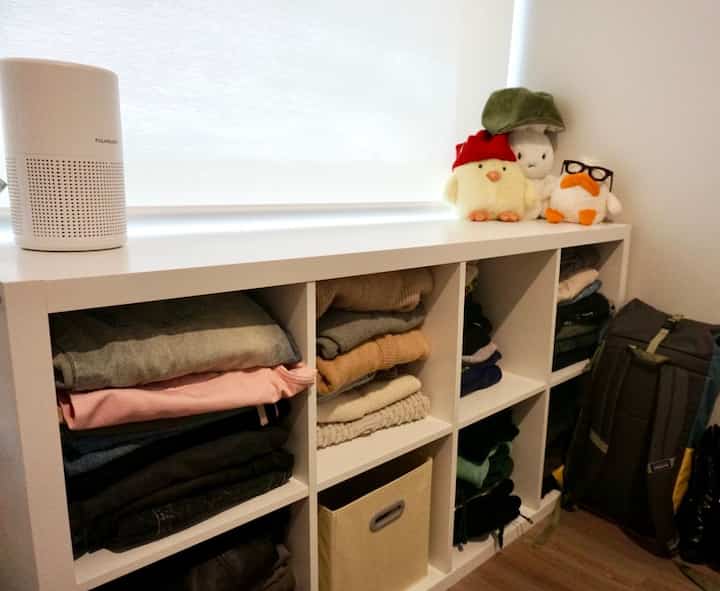 Organizing clothes can be super tedious, but found a way around using a bookcase as clothing storage! #clothingstorage #organization #storagesolutions #repurposed