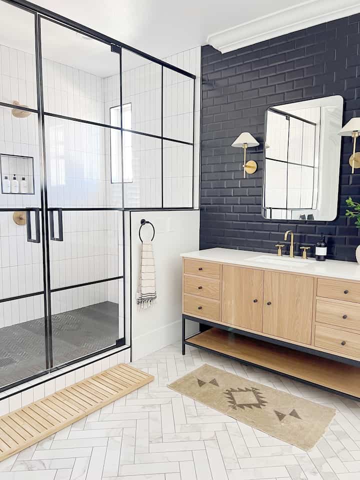 Modern bathroom design. #roomandboard #bathroomstorage #blackframedshower