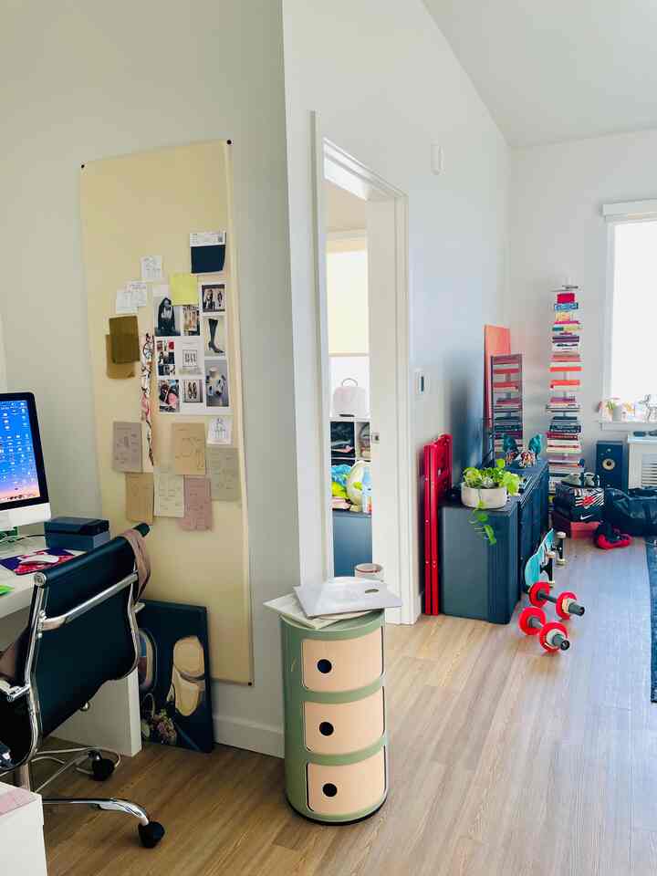 The open space in my apartment allows for me to break up different areas of work and living #worklive #openspace #tallceilings #popsofcolor