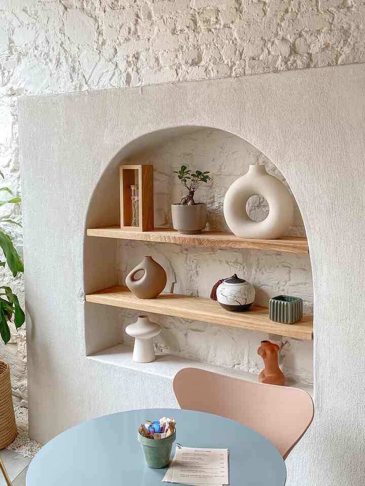 Finding interior inspo at every corner. This cozy nook at Café Chiffon in Cape Town, South Africa has me dreaming of soft textures and warm tones. #InteriorInspo #CafeVibes #beigeinterior #ceramicvase #vase #plantershelf #woodshelf