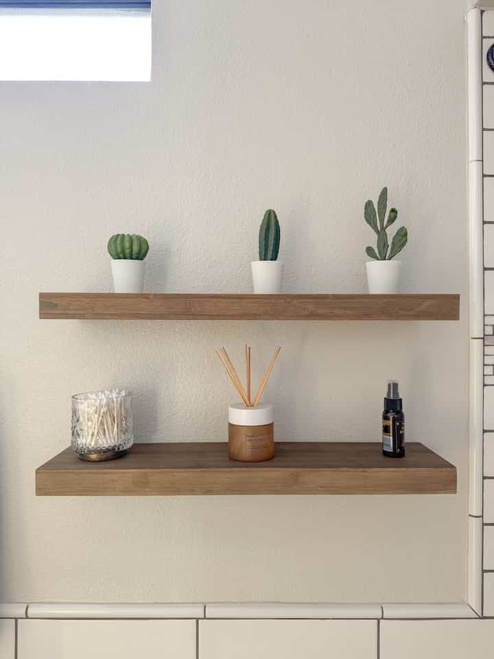 Added a touch of green with some faux plants from Ikea — simple, fresh vibes for my wood floating shelf. 🌿


#bathroom #bathroomdecor #diffuser #minimalist #floatingshelf #WoodInterior #natural #whitetiles #smallspace