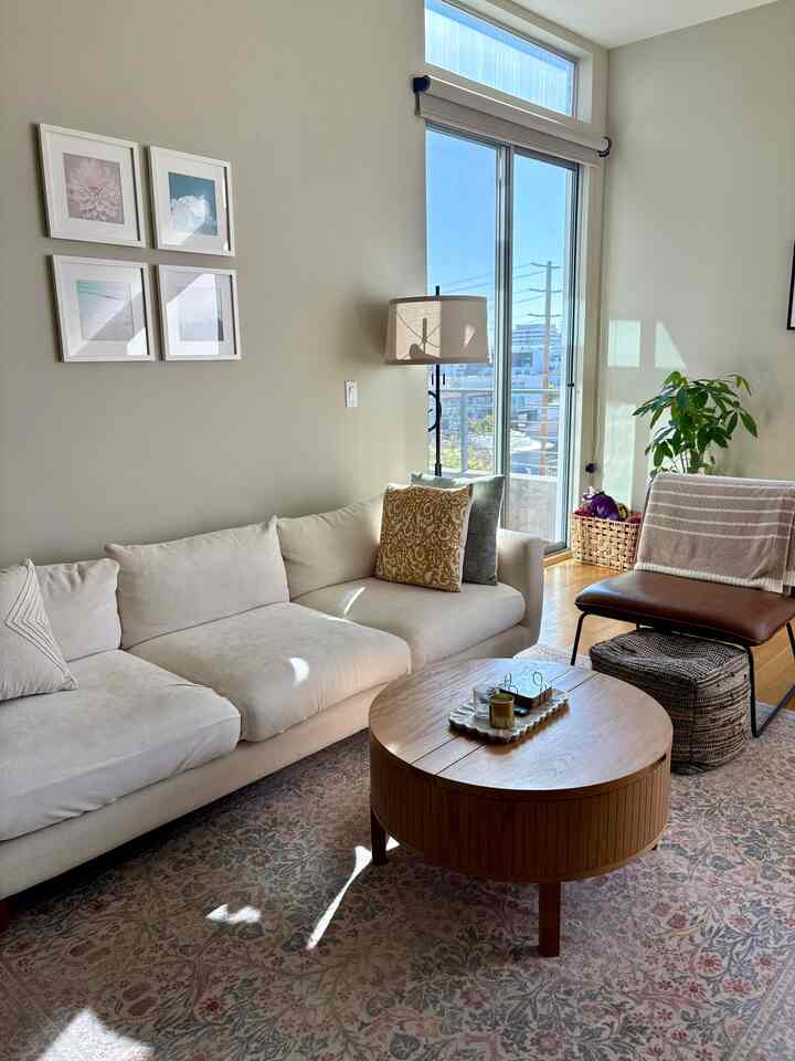 Sprinkling floral patterns around my living room 🌼 #cozyhome #warmhouse #midcenturymodern #whitesofa #sunlight 