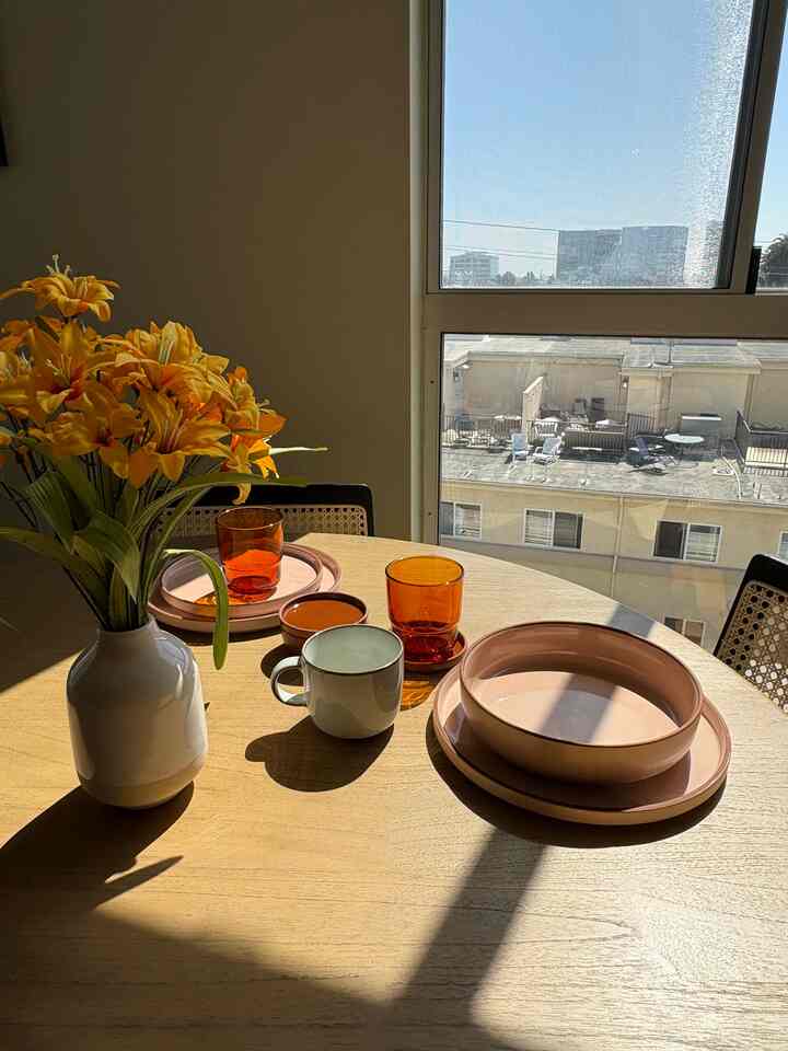 Colorful, soft, & dreamy tablescape ft. Our Place dinnerware #ourplace #sunset #warmtones #dinnerware #tableware #tablesetting 