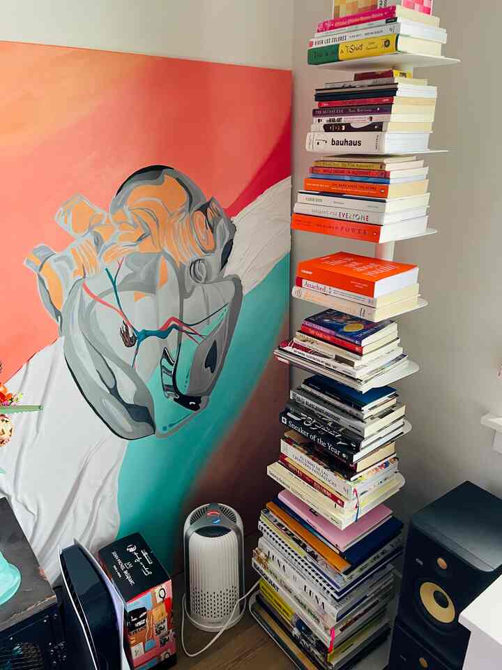 One of my favorite corners in my living room! #artist #bookcase #bookstorage #popofcolor