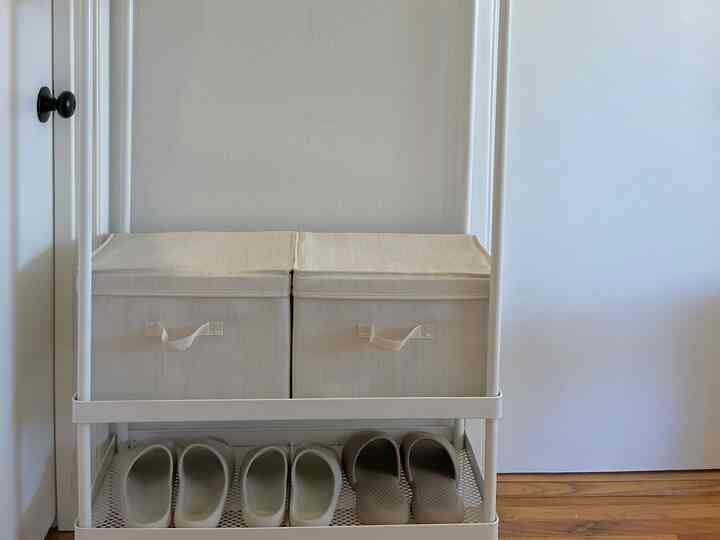 White-tone compact space featuring shoes and fabric storage boxes arranged neatly