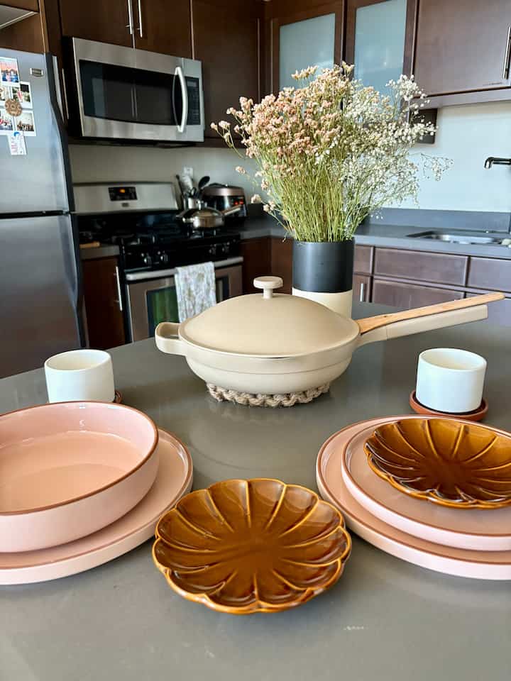 How to brighten and soften a dark walnut kitchen: lots of pink and cream tones! 🩷🤎 #warmtones #kitchen #countertop #ourplace #alwayspan #dinnerware #tablesetting 