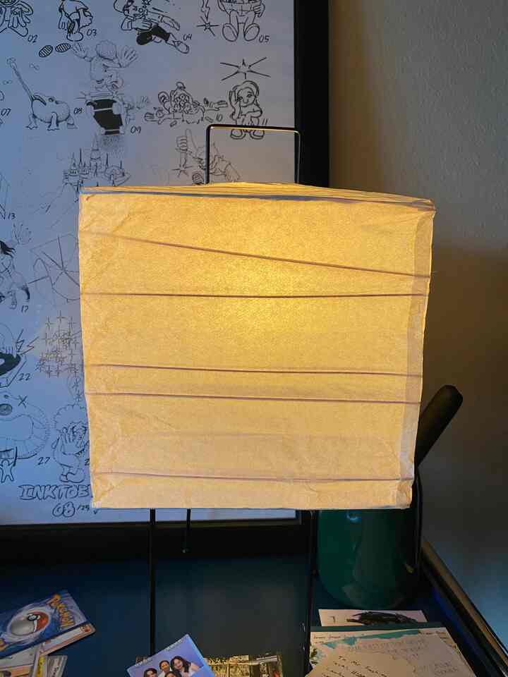 Warm beige-toned Japandi style home office space featuring an Akari table lamp on a desk with cozy ambiance