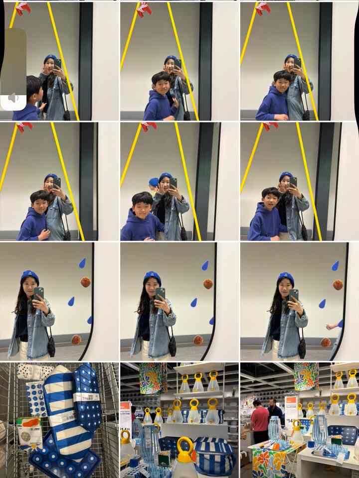 A space featuring a large black-framed mirror centered on the wall where a woman and a young boy take selfies together, reflecting a personal and casual atmosphere