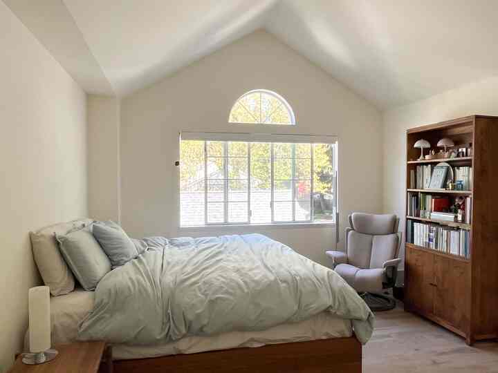 Swapped in bedding that complements the blue tones of the artwork and moved the recliner to find a better rhythm in the space. 
#bedding #naturalstyle #woodencabinet 