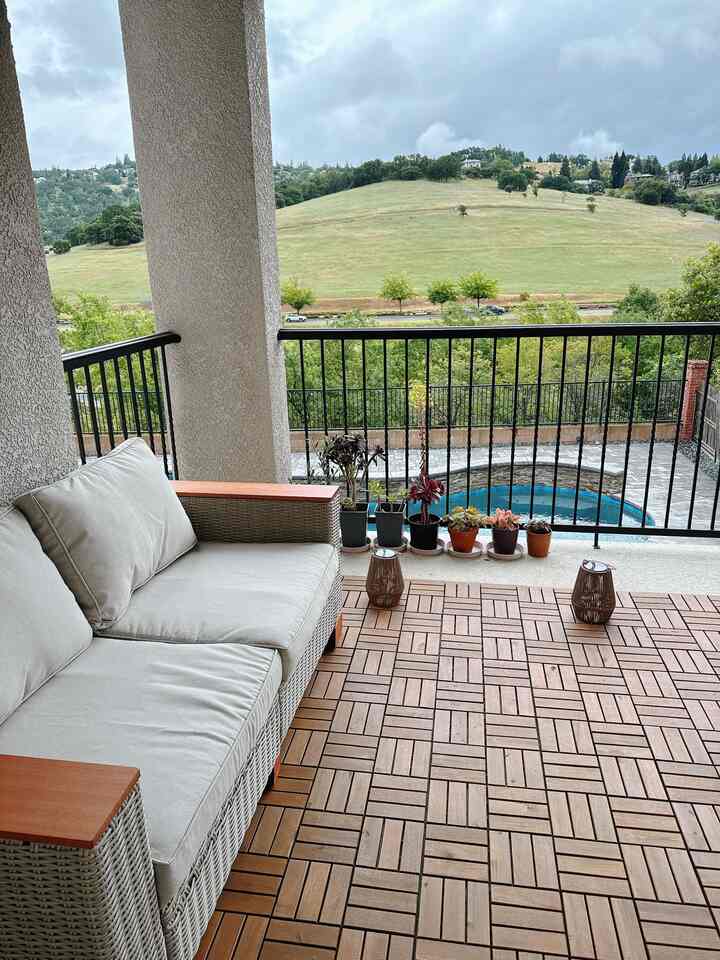 The view from the second-floor patio.
We laid down wood tiles to make it easy to move between indoors and outdoors, and we sometimes enjoy barbecues here with family.

#patio #outdoor #exterior 