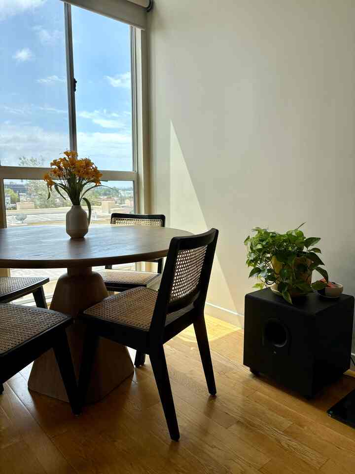 When the sun hits just right 🌆 #diningroom #diningtable #woodencabinet #wovenfurniture #midcenturymodern