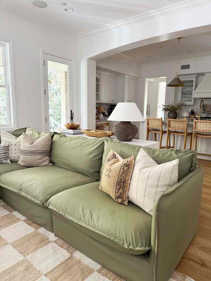Green living room couch. #livingroomdesign #livingroomcouch #livingroominteriors