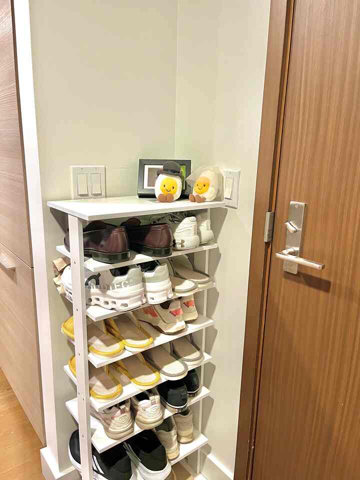 White-toned narrow entrance featuring a 7-tier shoe rack efficiently placed in a wall gap, creating a tidy space