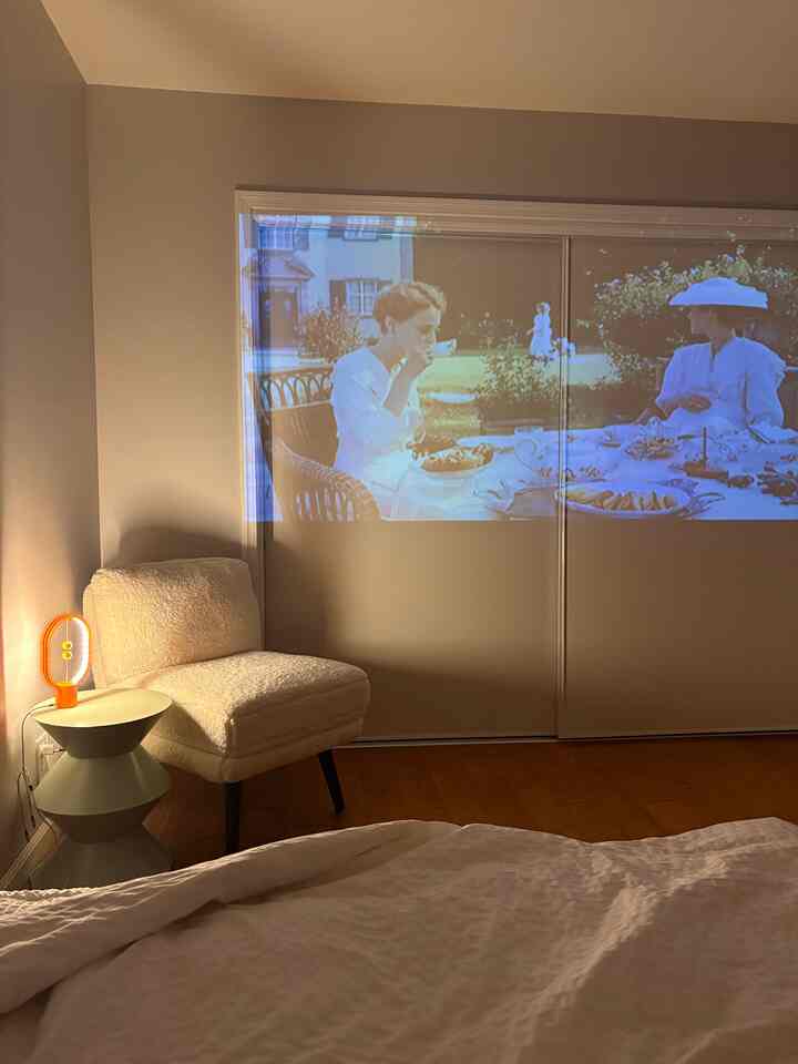 Sometimes, a screen like this—less sharp but softer—feels more sentimental than a perfectly clear one.✨ 

#ProjectorNights
#MovieNightVibes
#CozyCinema
#HomeTheater
#ProjectorLife
#DimlyLitRoom
#EveningVibes
#CinematicMood
#HomeMovieSetup
#ProjectorLove