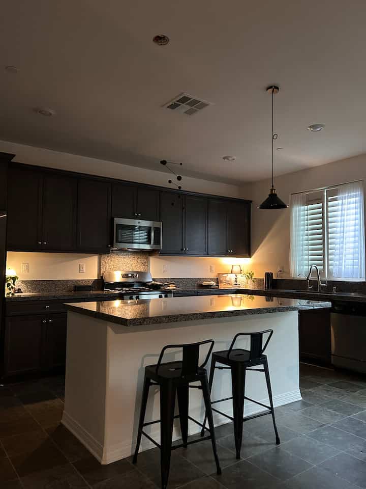 The kitchen bathed in the golden hush of sunset.
It’s where I spent the longest part of my day today — and maybe, the most meaningful☺️
#kitchen #blackinterior #blackkitchen #diningtable #barchair #islandkitchen 