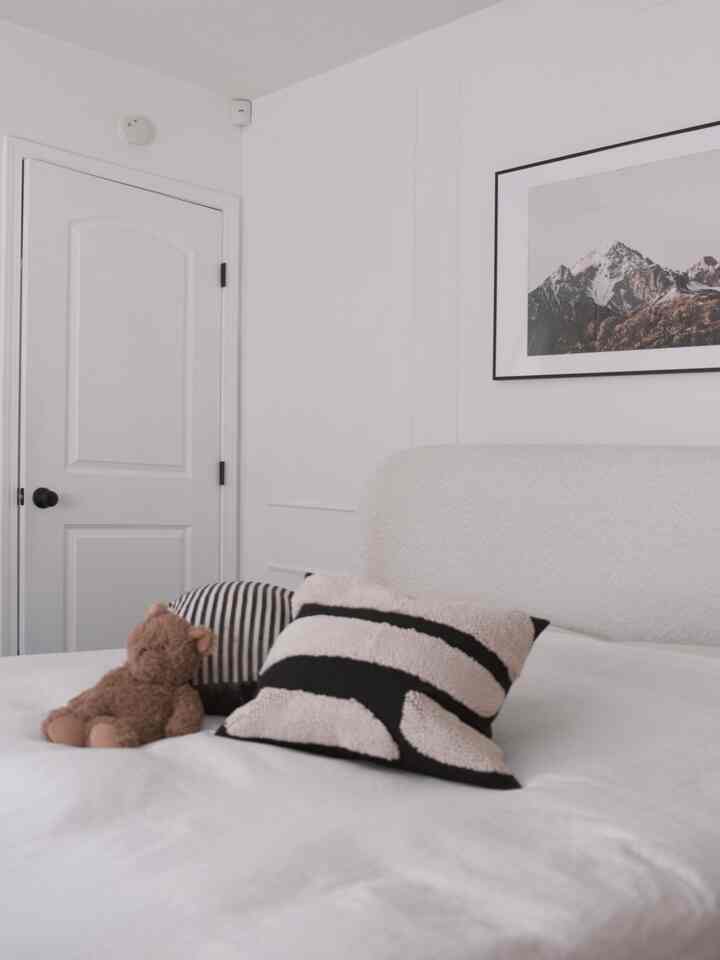 Getting ready for the chilly fall with a fuzzy black and ivory patterned cushion and a microwaveable teddy bear in the bedroom.

#latesummer #fallswitch #summertofall #seasonaldesign #cushion #bedroom #queenbed #midcentury #Nordicinterior #Modern #cozybedroom #westelm #blackinterior 
