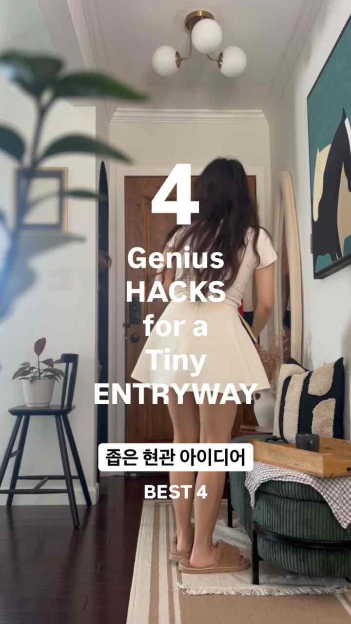 White and wood tone small entrance featuring plants and cushions in a natural modern style interior