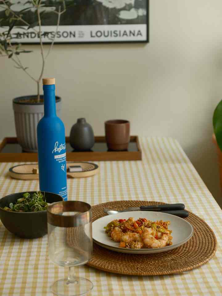Beige and natural toned dining room featuring ceramic plates and gingham tablecloth for a wholesome meal setting