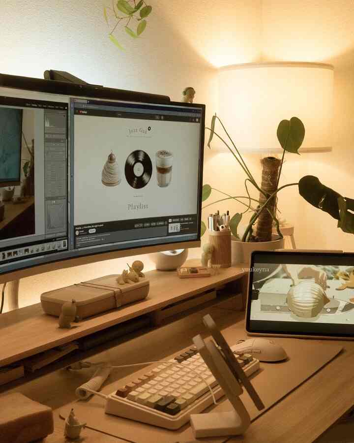 Warm wood tone home office for remote work featuring curved monitor, desk shelf, and leafy plant creating cozy ambience