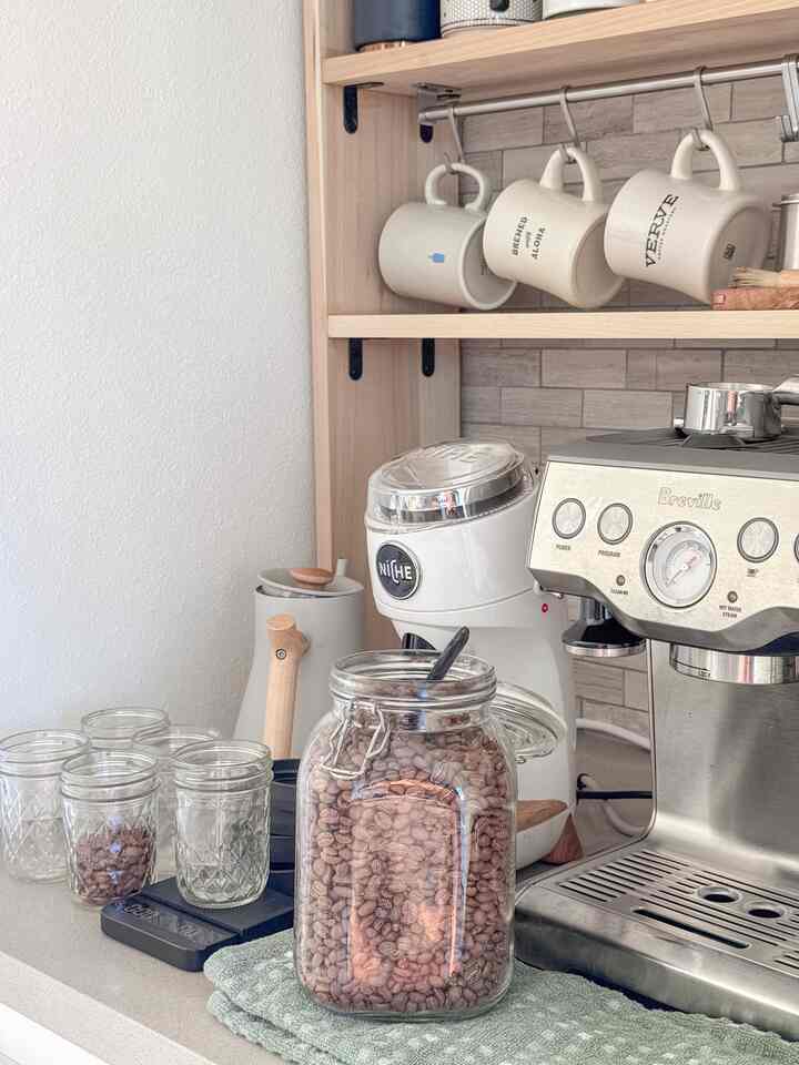 Prepping my daily caffeine doses ahead of time — because mornings are hard enough.

#homecafe #coffeebar #coffee #masonjars #ginder #niche #breville #coffeebeans #fellow #ikea #shelf