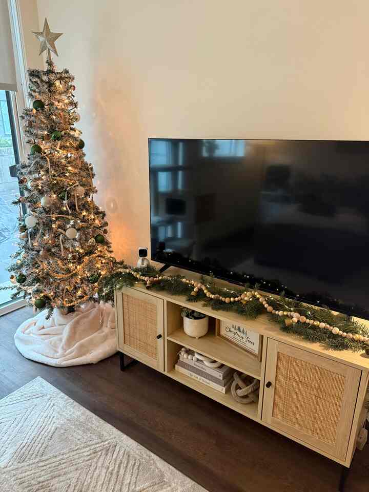 all is calm, all is cozy 🎄 love styling my Nathan James tv cabinet for the different seasons! #nathanjames #livingroom #christmasdecor