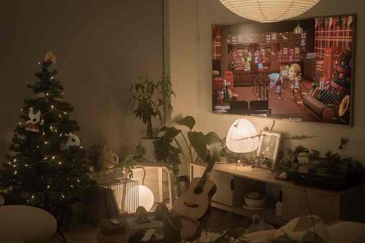 Warm wood-toned Mid-Century Modern living room featuring a cozy Christmas tree, plants, and ambient lighting with a relaxed atmosphere