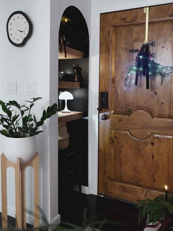 Timeless style meets a warm holiday glow! ✨ My entryway corner is now complete with this wavy retro wall clock and the iconic mushroom lamp. It’s where functionality meets festive magic, making every homecoming a little more special.

 #OhouseHoliday #OhouseGlow #EntrywayDecor #MushroomLamp #WallClock #CozyHome #HomeForTheHolidays #DecemberGlow #wallclock #modern #tinyentrance #diyopenshelf #holidaydecor