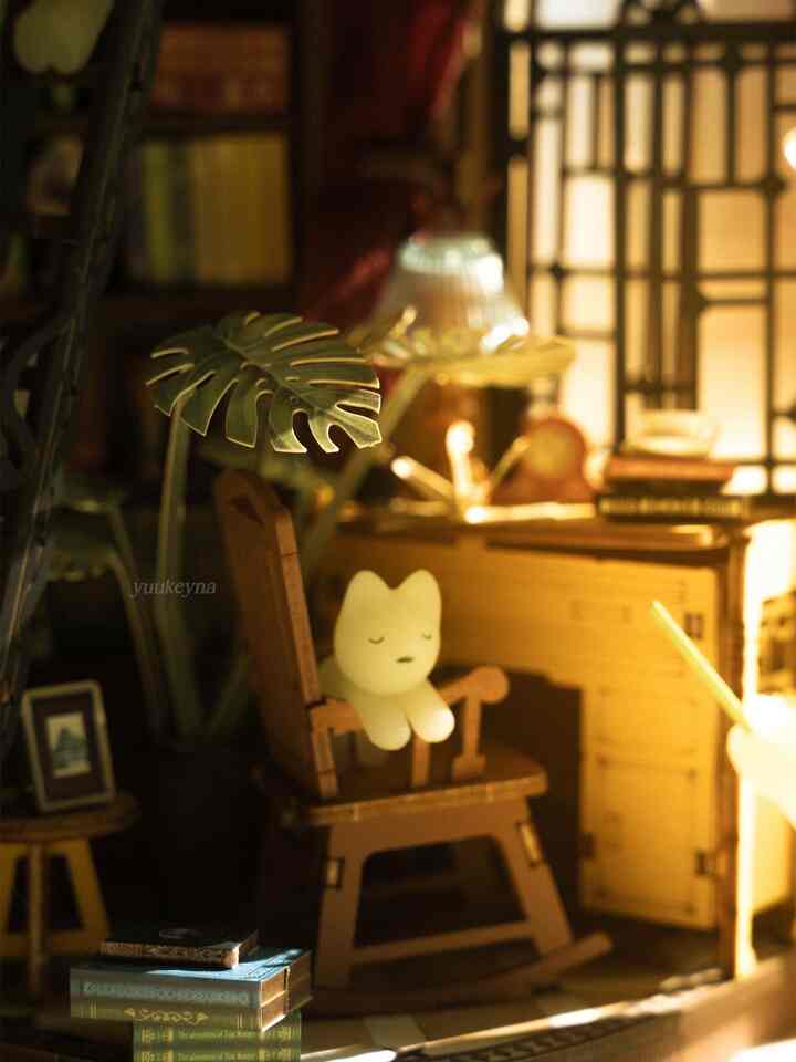 Cozy home office space with vintage wooden furniture and a small glowing figurine under warm golden lighting