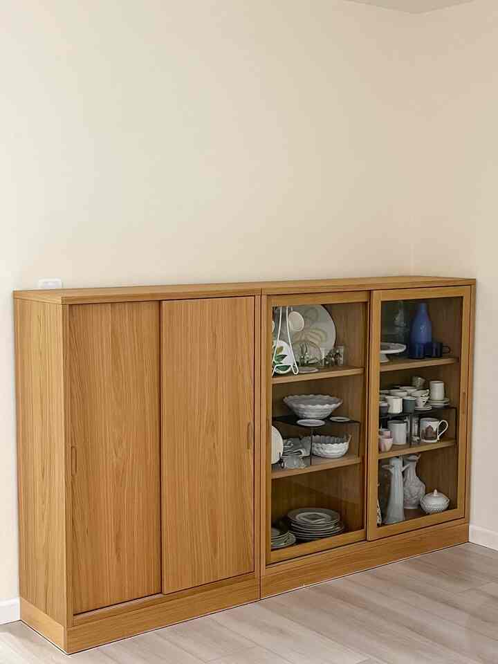 Bright 6-tatami room with simple natural wood tone cabinet placed against white walls