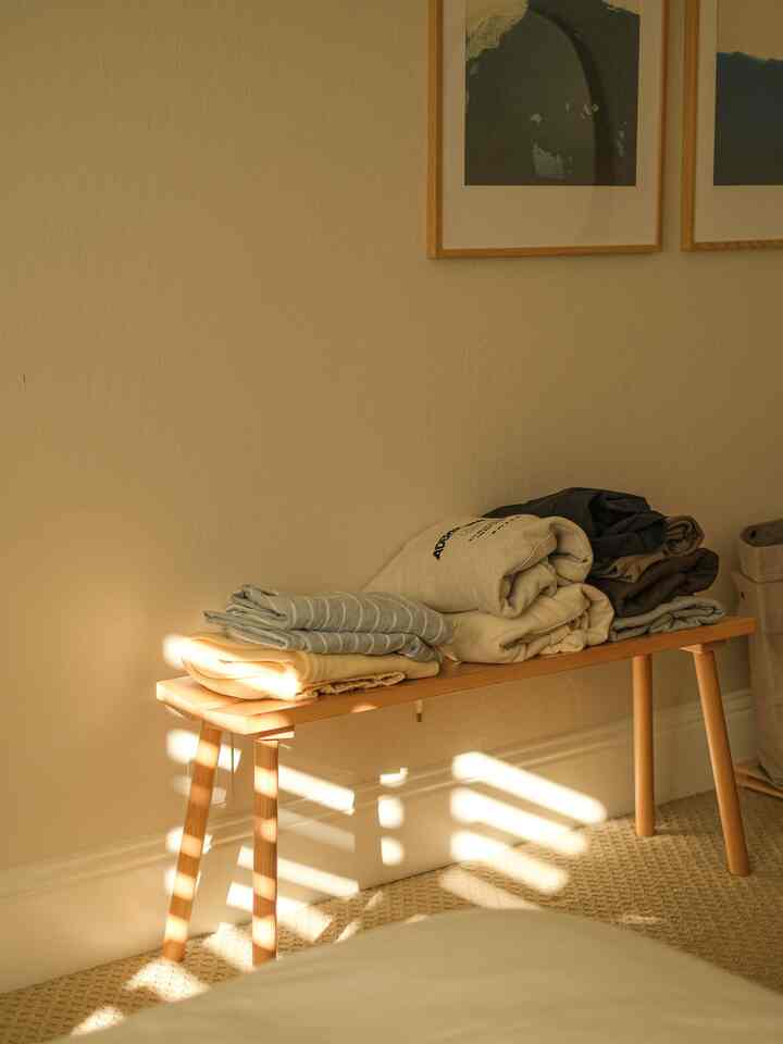 For a tight bedroom space, use a bench to store PJs or not-yet-dirty-clothes, if you know what I mean 😉 More surface than a chair so you can spread them out a little more when folded neatly. 

#bedroominterior #bedroomdecor #cozybedroom #platformbed #woodenfurniture  #minimalinterior 